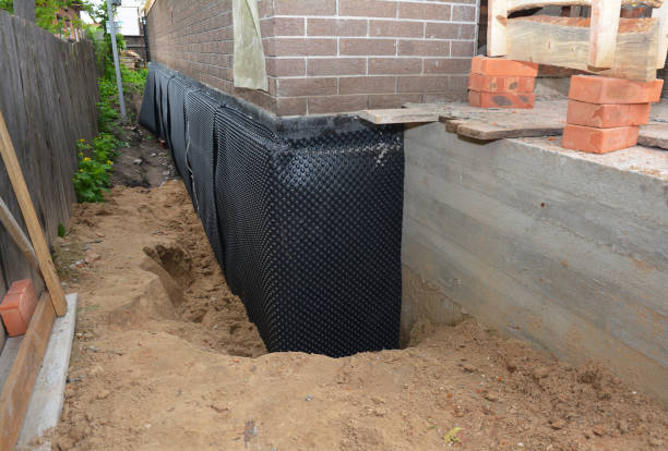 Happy homeowners after waterproofing job in Knightsville